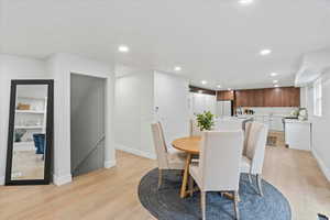 Dining space featuring recessed lighting and light wood-style floors