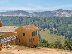 View of mountain backdrop with a heavily wooded area