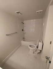 Full bath with toilet and tub / shower combination