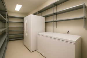 Laundry room featuring light tile patterned floors