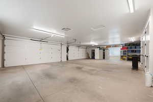 View of garage with two 18' foot doors and air-conditioning