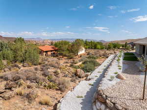 View of terraced rear lot and natural terrain.