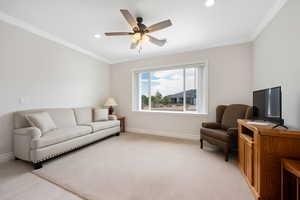 ADU Living area featuring crown molding, a ceiling fan, recessed lighting, and light carpet