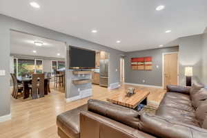 Living area featuring recessed lighting and light wood-type flooring