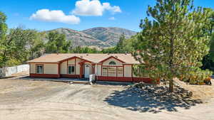 View of front of home featuring a mountain view