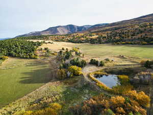 Mountain view with a large body of water and rural landscape