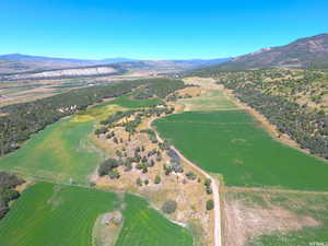 Aerial view of property's location with a mountainous background