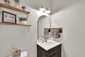 Bathroom with vanity and toilet