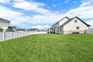 Fenced backyard with a residential view