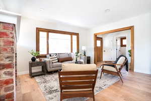 Living area featuring light wood-style floors and recessed lighting
