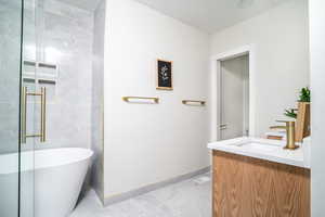 Bathroom featuring vanity and a freestanding tub