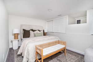 Bedroom with carpet and a textured ceiling