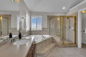 Owners bedroom suite with jetted tub, shower & walk in closet