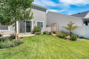 Rear view of house with stucco siding