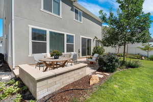 Back of house featuring stucco siding and a patio