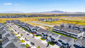 Aerial view of residential area featuring a mountainous background