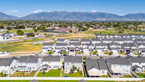 Aerial view of residential area featuring a water and mountain view