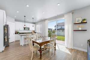 Dining space featuring light wood-type flooring and recessed lighting