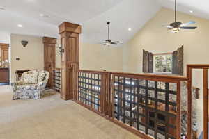 Living area featuring ceiling fan, carpet flooring, recessed lighting, and high vaulted ceiling