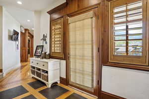 Entryway with baseboards and recessed lighting