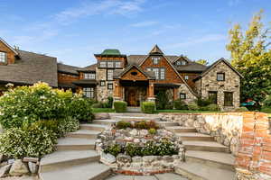 View of front facade featuring stone siding