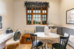 Dining room with wood finished floors and baseboards