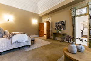 Bedroom featuring carpet and wood ceiling