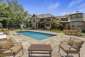 Outdoor pool featuring a patio area, an outdoor living space, and outdoor dining space