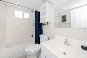 Bathroom featuring shower / tub combo and vanity