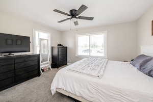 Bedroom with carpet and a ceiling fan