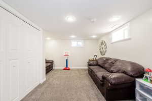 Living room with carpet floors and baseboards