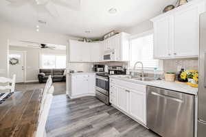 Kitchen with appliances with stainless steel finishes, tasteful backsplash, healthy amount of natural light, and recessed lighting