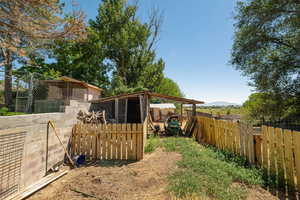 View of yard with an outdoor structure