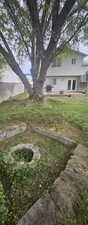View of yard featuring a fire pit and a patio area