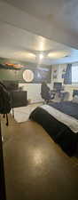 Bedroom featuring a textured ceiling and a desk