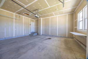 Garage featuring a garage door opener