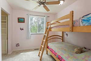 Bedroom with carpet flooring and baseboards