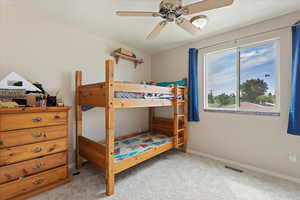 Bedroom featuring carpet and a ceiling fan