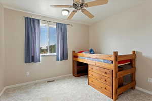 Bedroom with carpet and a ceiling fan