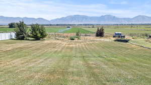 View of mountain backdrop with rural landscape