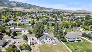 Aerial perspective of suburban area featuring a mountain backdrop