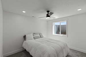 Basement bedroom connected to the bathroom. Wood encased windows.
