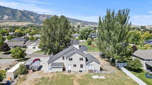 Aerial perspective of suburban area with a mountainous background