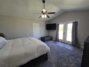 Main floor master bedroom new paint with vaulted ceilings, french doors, ceiling fan.