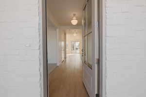 Entryway Hallway featuring light wood finished floors