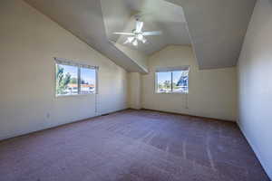 Bonus room featuring carpet, ceiling fan, and lofted ceiling
