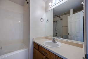 Bathroom featuring shower / bath combination and vanity