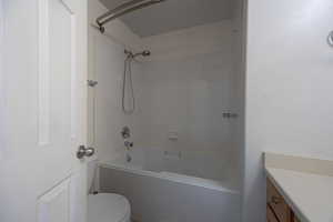 Full bath with vanity and shower / washtub combination