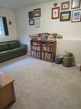 Living area with carpet floors and baseboards