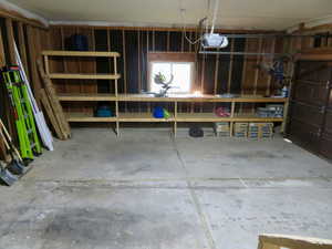 Garage featuring a garage door opener